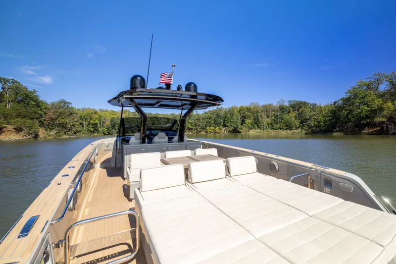 Slide: The Image of 2023 Pardo Yachts 43 on serene lake, featuring spacious deck and luxurious seating. - 47