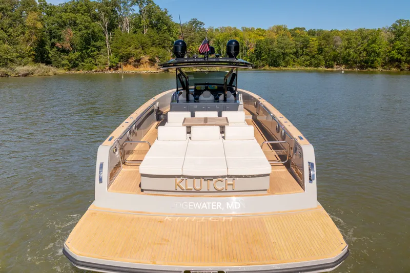 Slide: The Image of 2023 Pardo Yachts 43 on serene water, featuring spacious deck and luxurious seating. - 16
