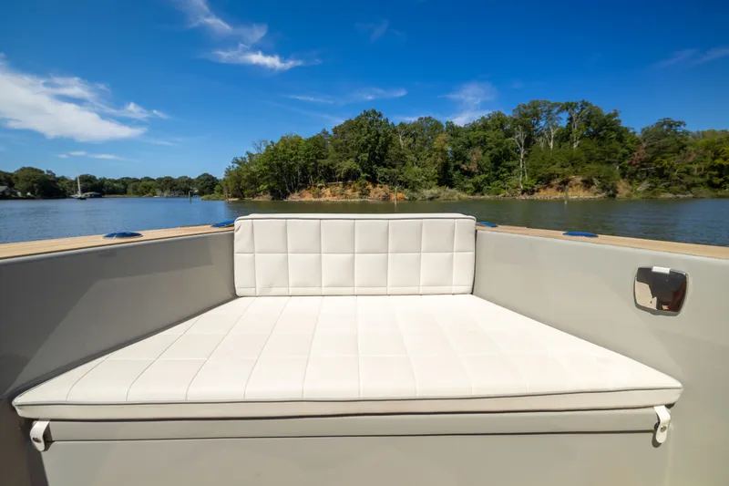Slide: The Image of Luxury seating on 2023 Pardo Yachts 43, with scenic water and forest backdrop. - 26