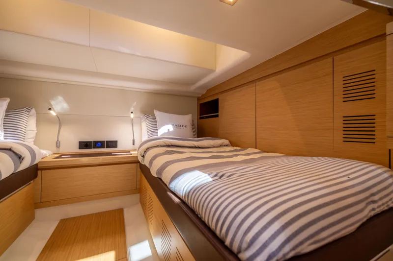 Slide: The Image of Luxurious cabin interior of 2023 Pardo Yachts 43, featuring twin beds and modern design. - 57