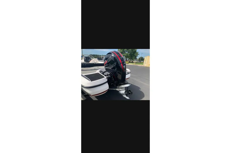 Slide: The Image of 2021 Nitro Z19 boat with powerful outboard motor in parking lot. - 3