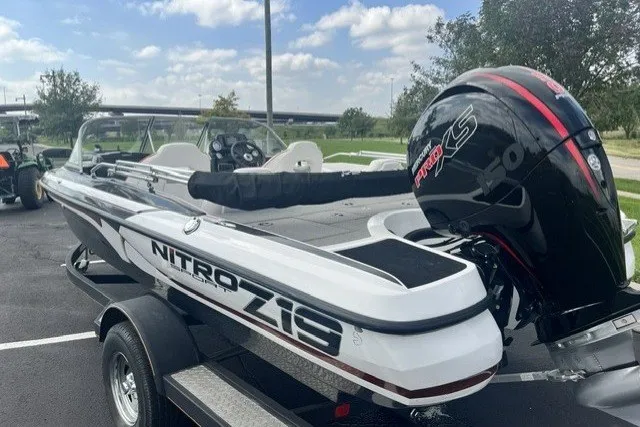 Slide: The Image of 2021 Nitro Z19 boat with powerful engine, parked outdoors on a sunny day. - 4