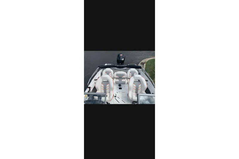Slide: The Image of 2021 Nitro Z19 boat interior with white seats and sleek design. - 6