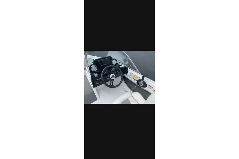 Slide: The Image of Steering console of a 2021 Nitro Z19 boat with gauges and controls. - 9