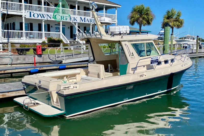 Slide: The Image of 2008 Albin 28 Tournament Express docked at Town Creek Marina. - 2