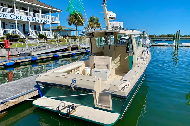 Slide: The Image of 2008 Albin 28 Tournament Express docked at sunny marina. - 4