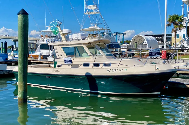Slide: The Image of 2008 Albin 28 Tournament Express boat docked at marina under clear blue sky. - 3