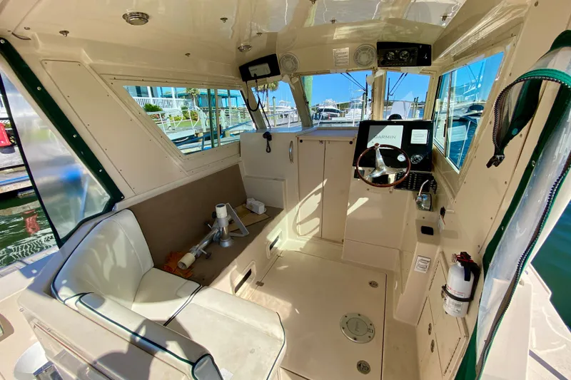 Slide: The Image of 2008 Albin 28 Tournament Express boat interior with steering wheel and navigation equipment. - 7