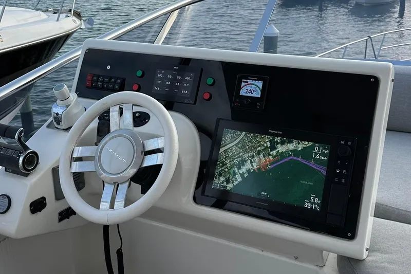 Slide: The Image of Cockpit of 2013 Azimut Fly 53 yacht with navigation display and steering wheel. - 32