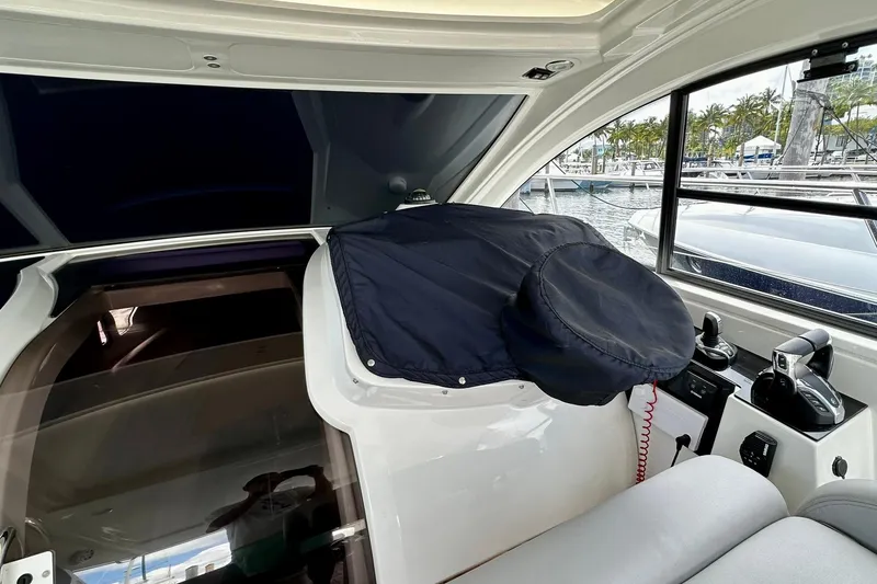 Slide: The Image of Interior of 2012 Beneteau Gran Turismo 34 yacht with covered helm and marina view. - 15