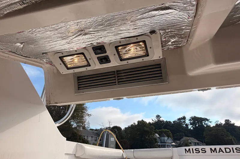 Slide: The Image of Ceiling view of 2003 Cabo 35 Express boat with lights and vent. - 48