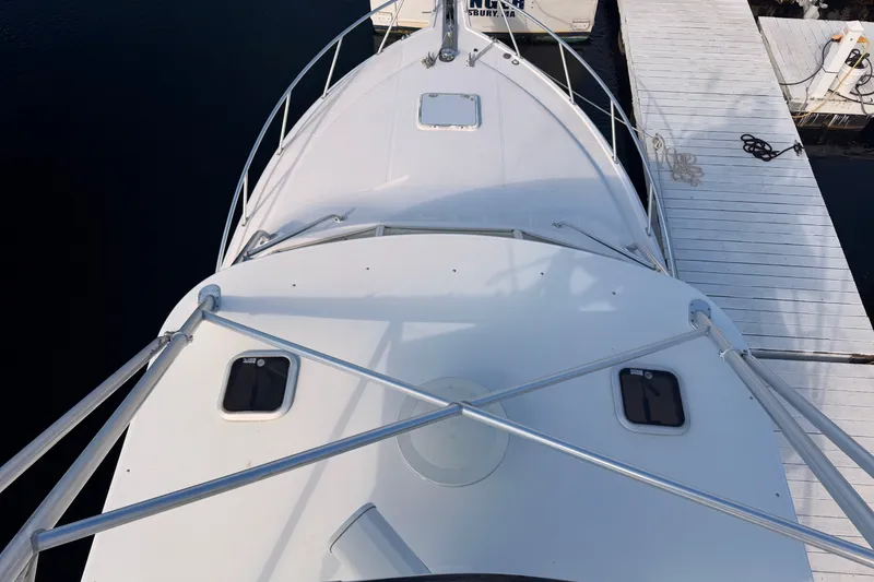 Slide: The Image of Aerial view of 2003 Cabo 35 Express boat docked at a marina. - 12