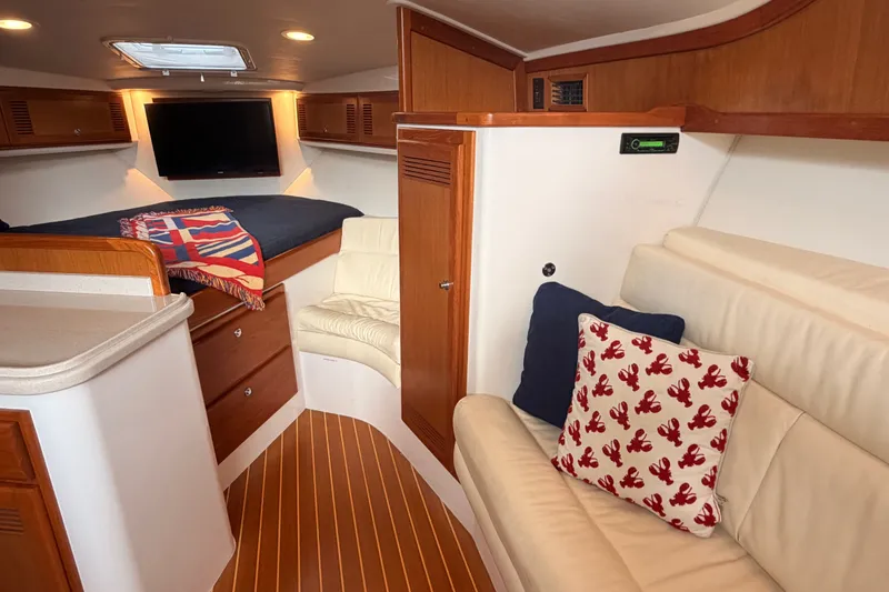 Slide: The Image of Interior of 2003 Cabo 35 Express yacht with cozy seating and modern amenities. - 42