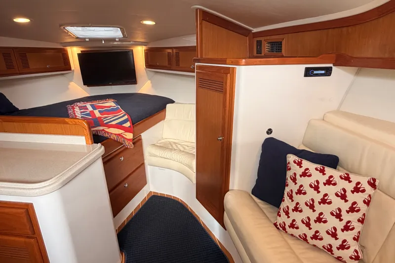 Slide: The Image of Interior of 2003 Cabo 35 Express yacht with cozy seating and modern amenities. - 40