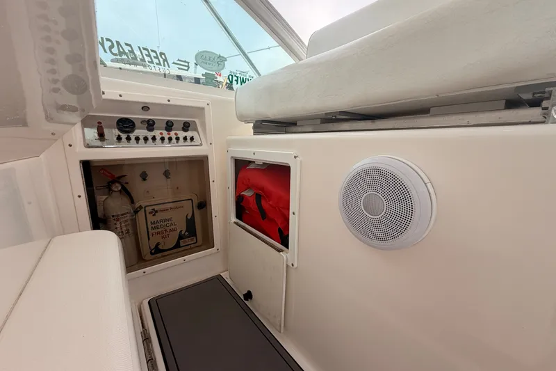 Slide: The Image of Interior of a 2003 Cabo 35 Express boat with safety equipment and control panel. - 26