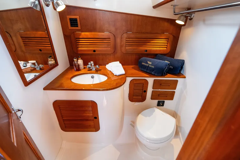 Slide: The Image of Luxurious bathroom in 2020 Hinckley Picnic Boat 37 MKIII with wooden accents. - 47
