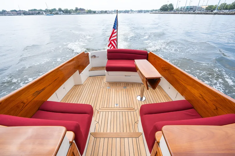 Slide: The Image of Hinckley Picnic Boat 37 MKIII 2020, elegant deck with red seating and wooden finish. - 14
