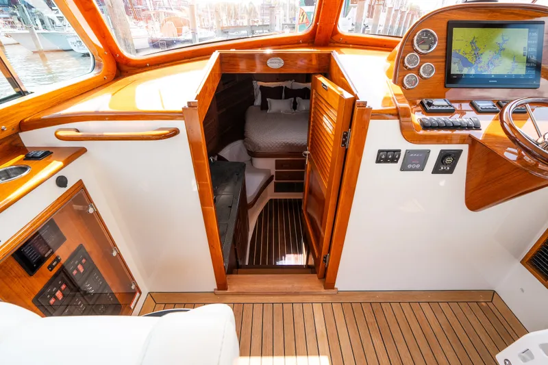 Slide: The Image of Interior of 2020 Hinckley Picnic Boat 37 MKIII with wood accents and navigation equipment. - 36