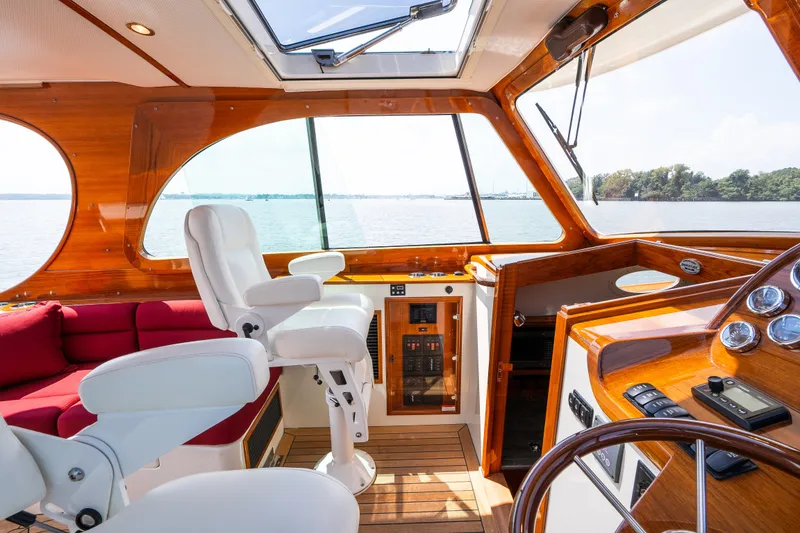 Slide: The Image of Luxurious interior of 2020 Hinckley Picnic Boat 37 MKIII with elegant wood finish. - 21