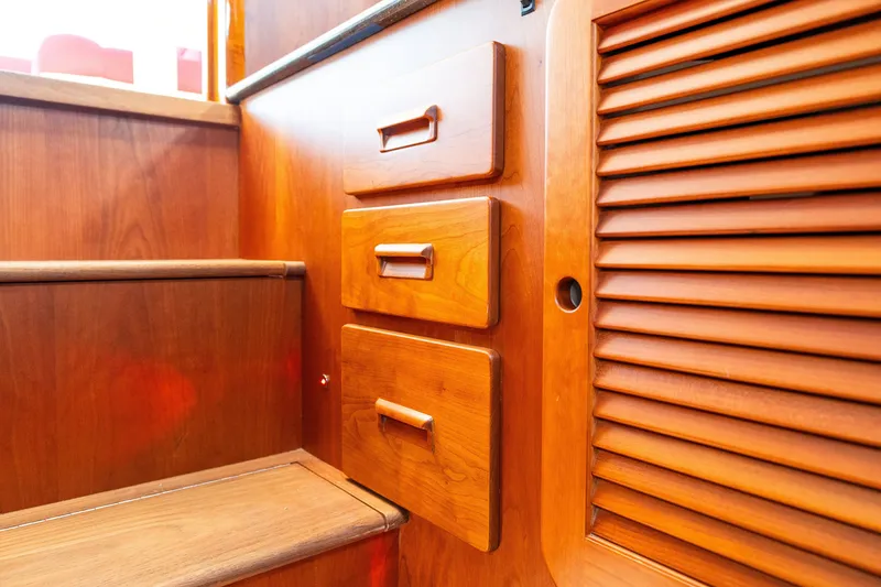 Slide: The Image of Wooden interior of 2020 Hinckley Picnic Boat 37 MKIII, featuring drawers and steps. - 49