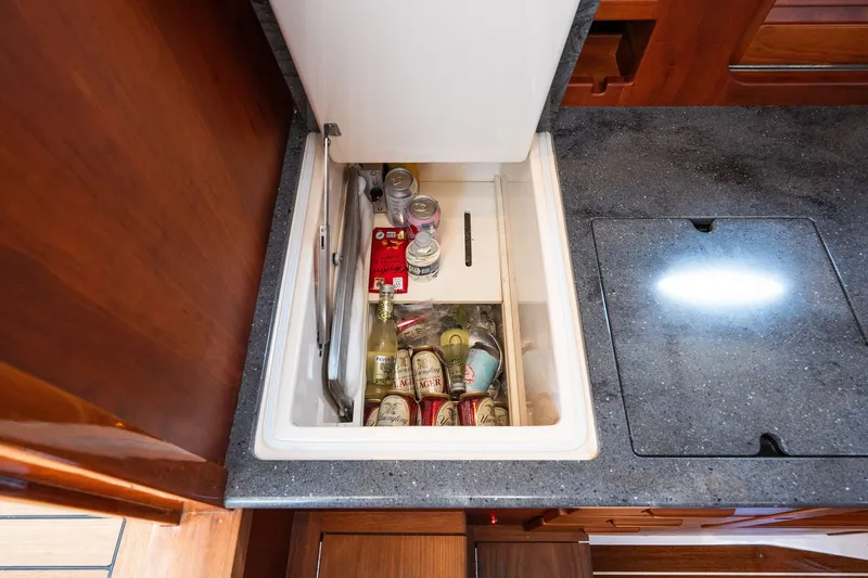 Slide: The Image of Built-in cooler with beverages inside Hinckley Picnic Boat 37 MKIII, 2020 model. - 39