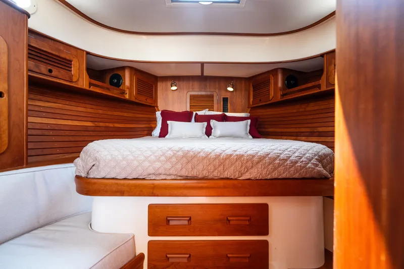 Slide: The Image of Luxurious cabin interior of 2020 Hinckley Picnic Boat 37 MKIII with elegant wood finish. - 42
