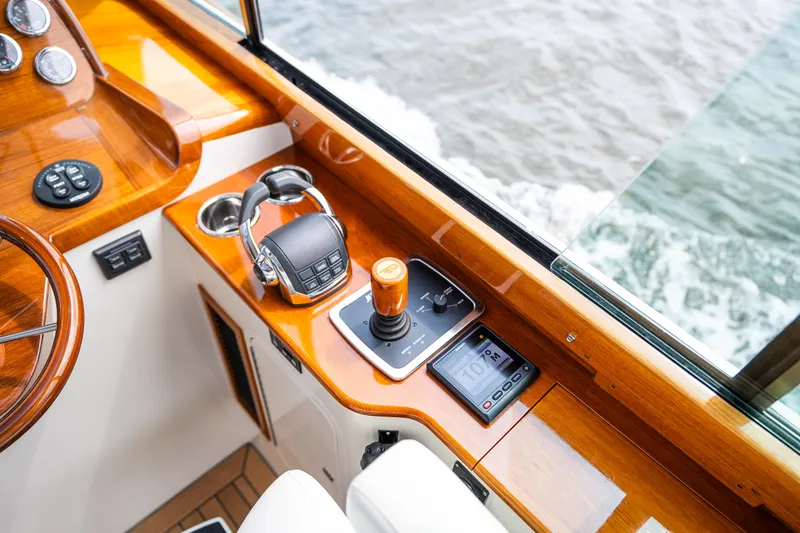 Slide: The Image of Helm of 2020 Hinckley Picnic Boat 37 MKIII with wooden finish and controls. - 25