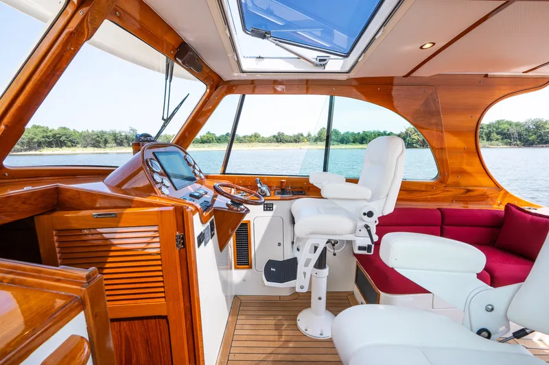 Slide: The Image of Luxurious interior of 2020 Hinckley Picnic Boat 37 MKIII with elegant wood finish. - 23