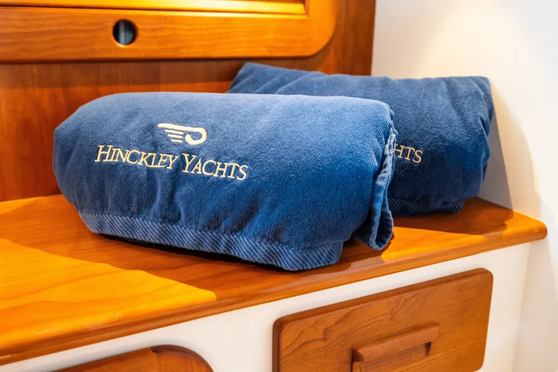 Slide: The Image of Blue Hinckley Yachts towels on wooden shelf, Picnic Boat 37 MKIII, 2020 model. - 50
