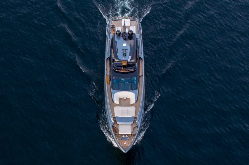 Slide: The Image of Aerial view of 2021 Riva 110' Dolcevita yacht cruising on open water. - 21