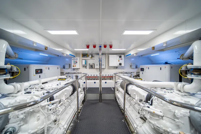 Slide: The Image of Engine room of 2021 Riva 110' Dolcevita yacht, featuring advanced machinery and controls. - 87