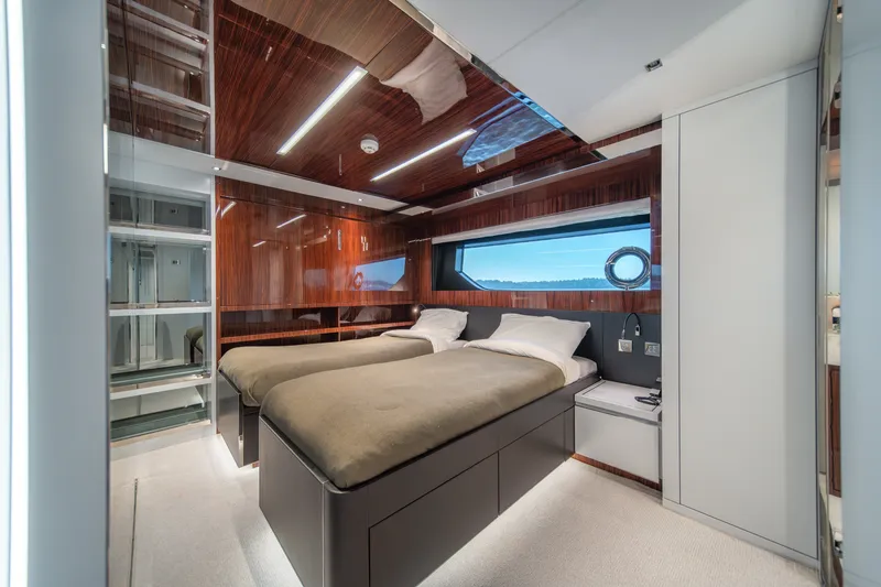 Slide: The Image of Luxurious cabin interior of 2021 Riva 110' Dolcevita yacht with twin beds and elegant wood finish. - 72