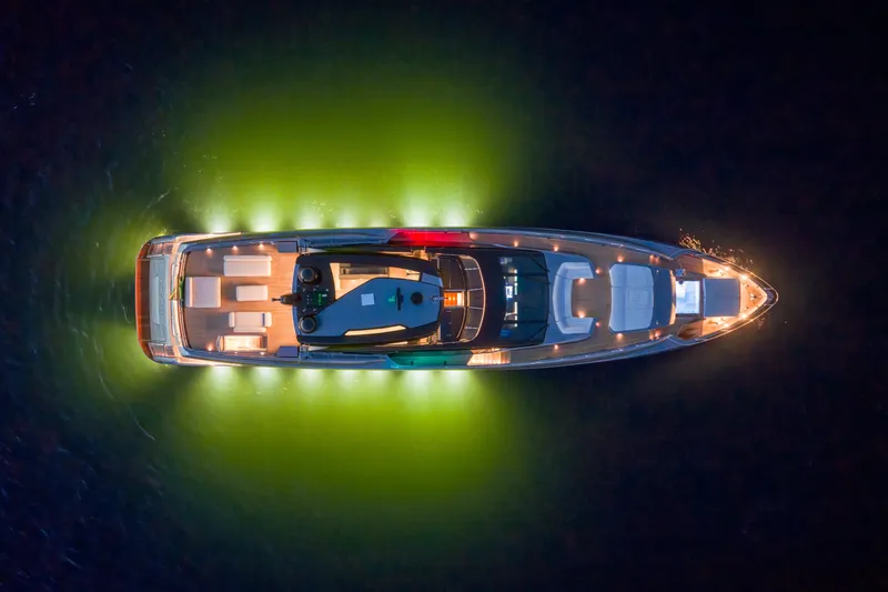 Slide: The Image of Aerial view of 2021 Riva 110' Dolcevita yacht illuminated at night. - 27