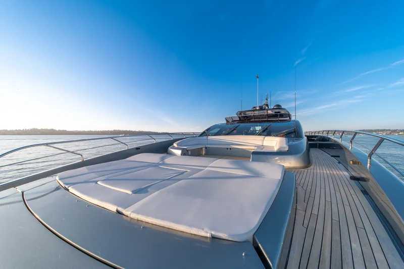 Slide: The Image of Luxurious 2021 Riva 110' Dolcevita yacht on serene waters under clear blue sky. - 31