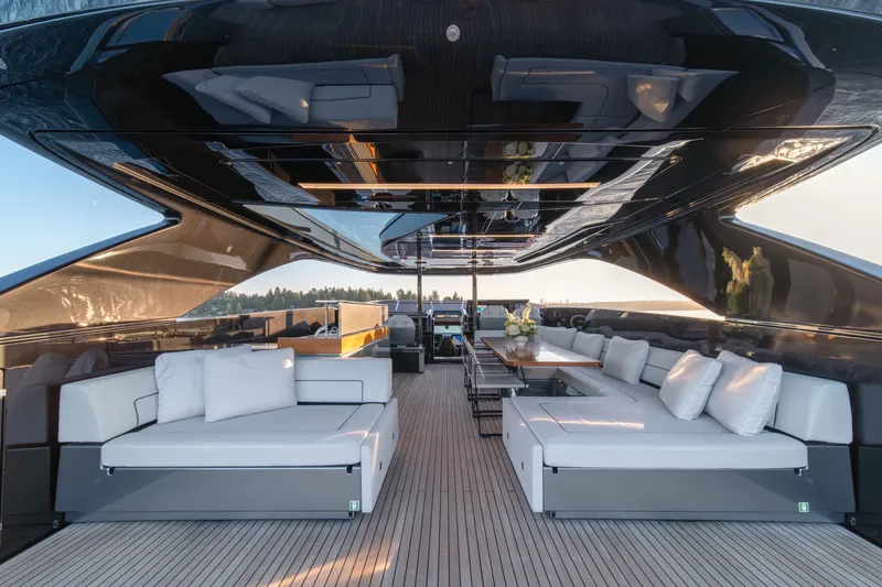 Slide: The Image of Luxurious 2021 Riva 110' Dolcevita yacht interior with elegant seating and dining area. - 38