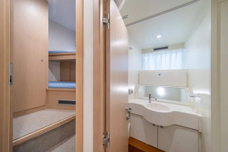 Slide: The Image of Luxurious bathroom and bunk area on 2021 Riva 110' Dolcevita yacht. - 86
