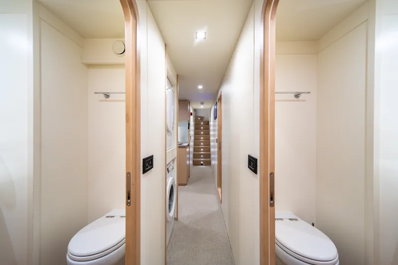 Slide: The Image of Luxurious interior of 2021 Riva 110' Dolcevita yacht, featuring dual bathrooms and modern amenities. - 85