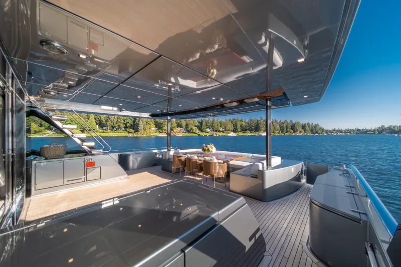 Slide: The Image of Luxurious 2021 Riva 110' Dolcevita yacht deck with elegant seating and scenic water view. - 44