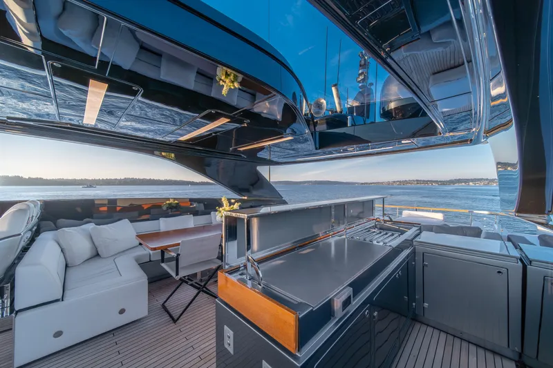 Slide: The Image of Luxurious 2021 Riva 110' Dolcevita yacht deck with modern outdoor kitchen and seating area. - 42