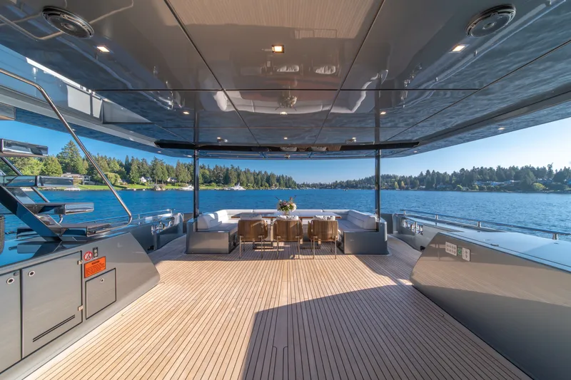 Slide: The Image of Luxurious 2021 Riva 110' Dolcevita yacht deck with elegant seating and scenic water view. - 43