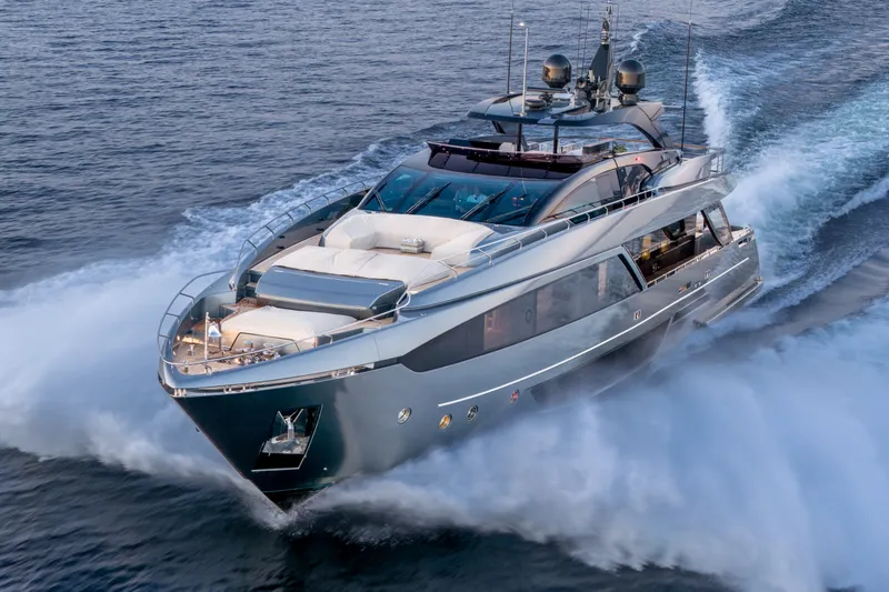 Slide: The Image of Luxury 2021 Riva 110' Dolcevita yacht cruising on open water. - 15