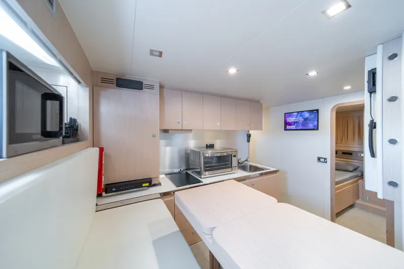 Slide: The Image of Modern kitchen interior on 2021 Riva 110' Dolcevita yacht, featuring sleek cabinetry and appliances. - 78