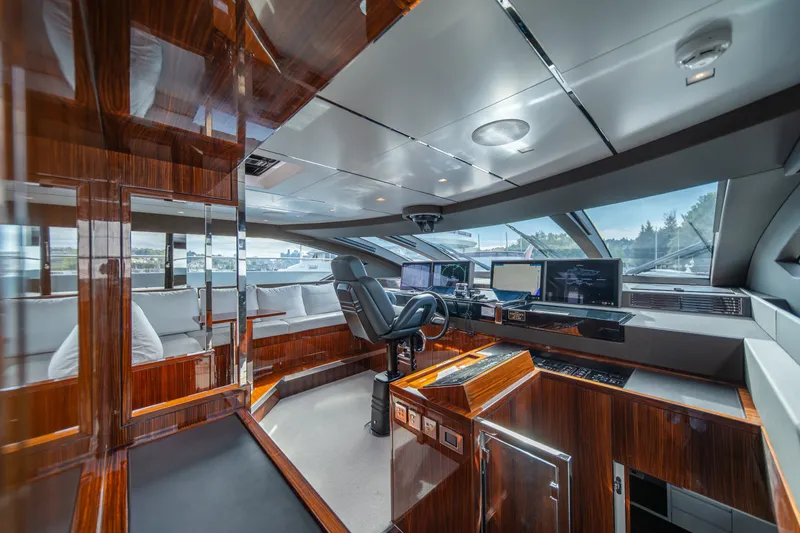 Slide: The Image of Luxurious interior of 2021 Riva 110' Dolcevita yacht with modern helm and seating area. - 50