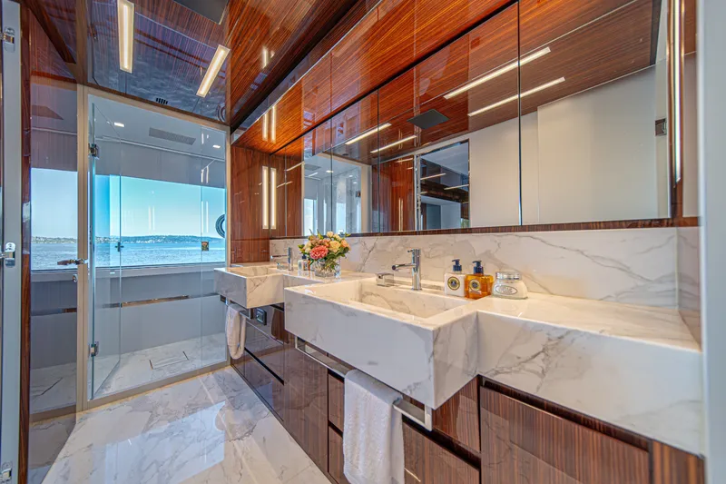 Slide: The Image of Luxurious bathroom on 2021 Riva 110' Dolcevita yacht with marble sinks and ocean view. - 58