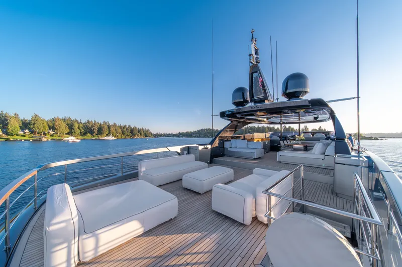 Slide: The Image of Luxurious 2021 Riva 110' Dolcevita yacht deck with elegant seating and scenic water view. - 36
