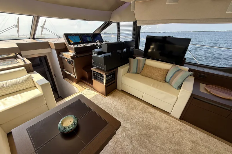 Slide: The Image of Luxurious interior of a 2017 Prestige 630 yacht with helm, seating, and sea view. - 22