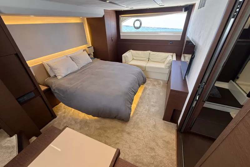 Slide: The Image of Luxurious 2017 Prestige 630 yacht bedroom with modern decor and ocean view. - 29