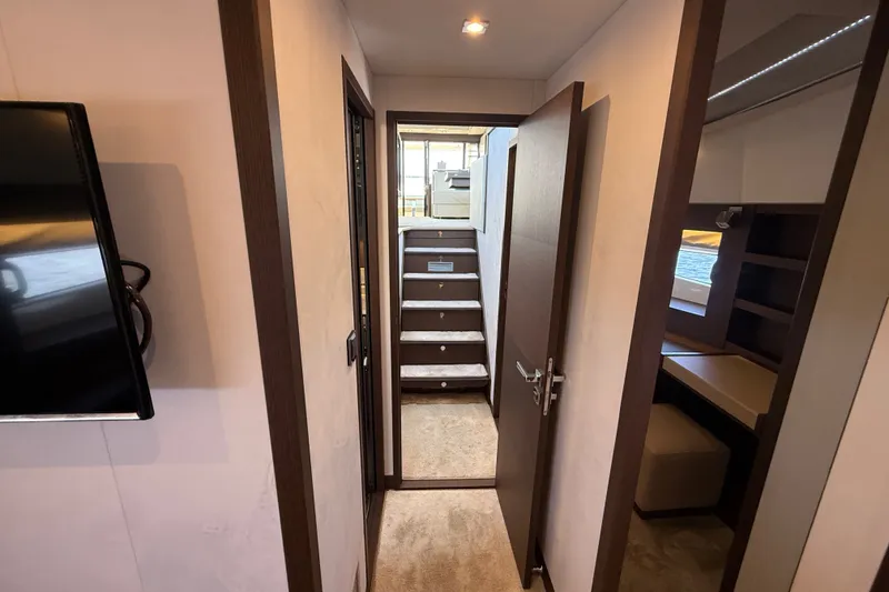 Slide: The Image of Interior hallway of 2017 Prestige 630 yacht with stairs and modern design. - 36