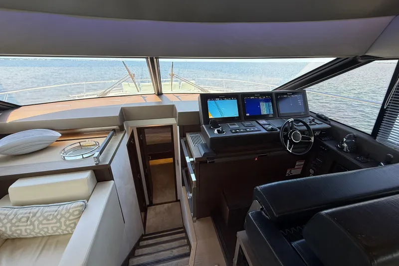 Slide: The Image of Luxurious 2017 Prestige 630 yacht interior with modern navigation controls and seating. - 25