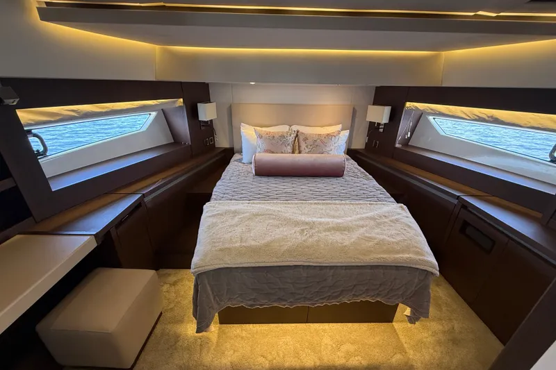 Slide: The Image of Luxurious bedroom interior of 2017 Prestige 630 yacht with elegant lighting and ocean view. - 38